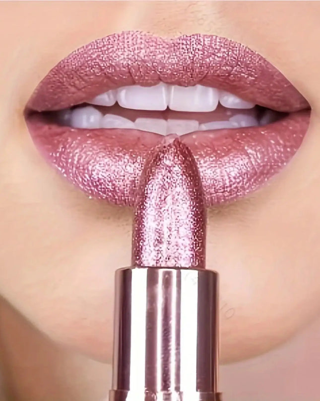 Close-up of a pink lipstick being applied to lips with a blurred background