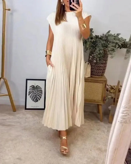 Women’s Elegant Sleeveless Dress with Pockets in Beige, showcasing a pleated design and stylish look.
