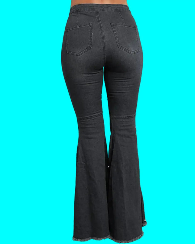 Black flared jeans on a turquoise background