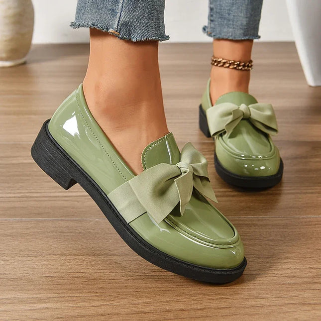 Bow tie loafers for women in green with a medium heel, round toe, and stylish bow decor for daily fashion.
