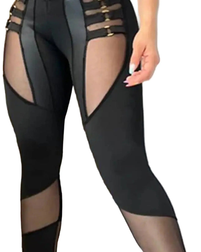 Black sheer leggings with mesh panels worn by a person against a neutral background