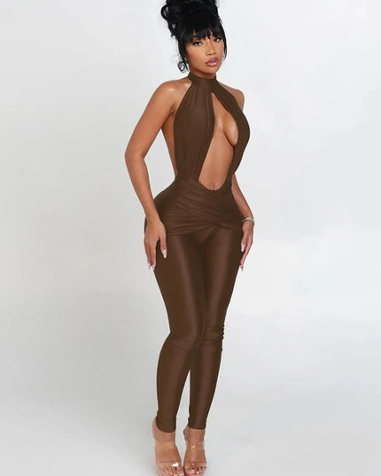 Woman wearing a brown jumpsuit with a halter neck design on a white background