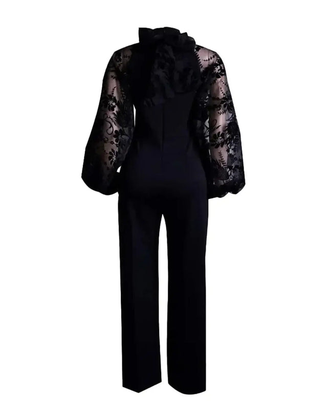Black jumpsuit with sheer lace sleeves on a white background