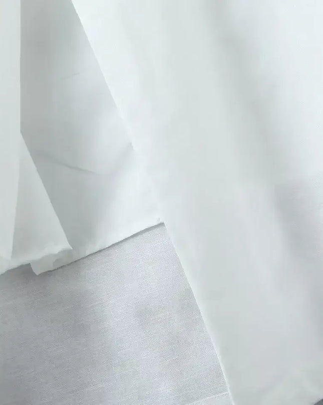 Close-up of soft white cotton linen fabric showcasing texture for a white cotton linen summer dress.