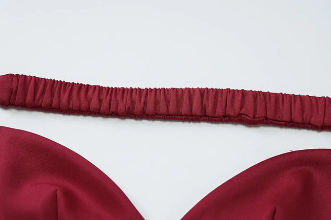 Close-up of the strapless design of an elegant off shoulder mini dress. Off shoulder mini dress party.