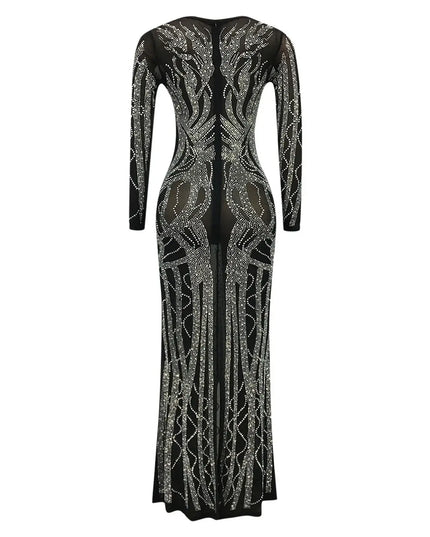 Black evening gown with silver embellishments on a white background