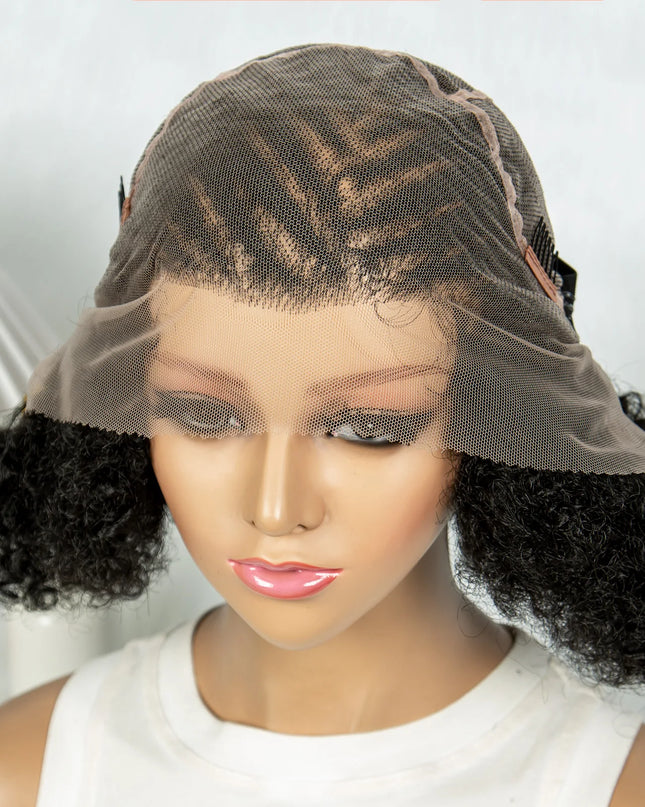 Mannequin head with a black curly wig on a white background