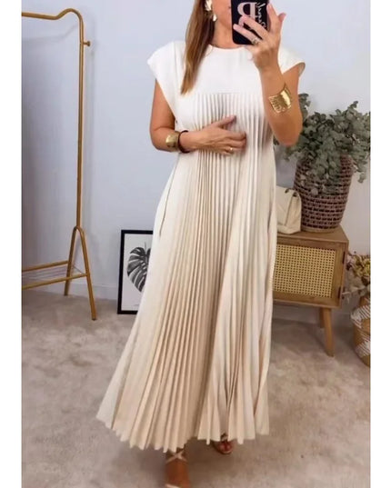 Women's elegant sleeveless dress with pockets in beige, featuring pleats and a flowy design, perfect for any occasion.