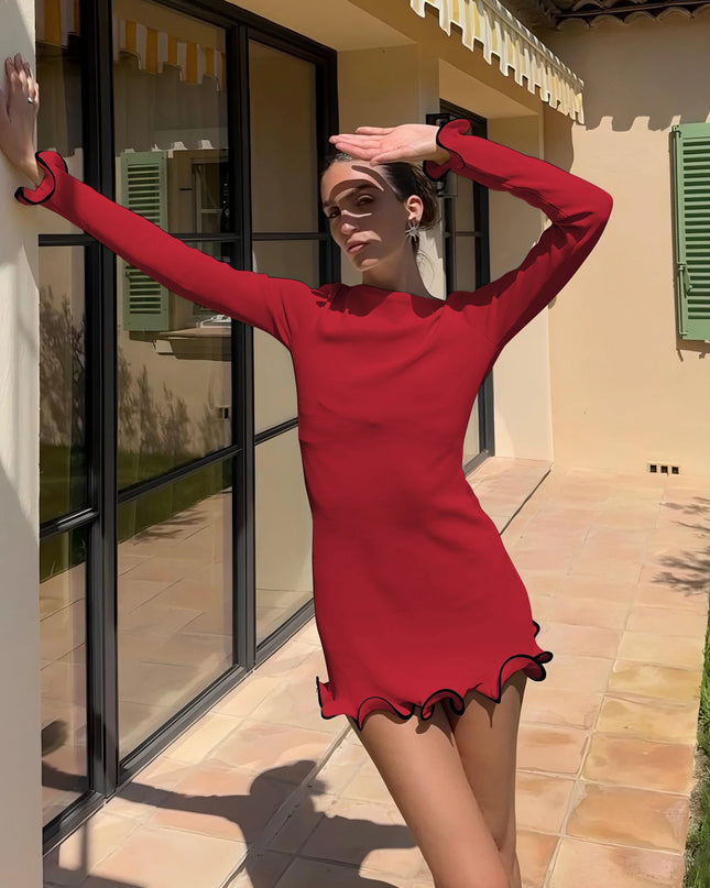 Model showcasing a women's bodycon mini dress with ruffled hem and long sleeves in a sunny outdoor setting.