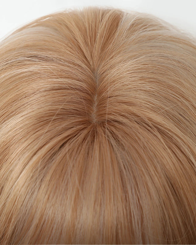 Close-up of a person with light brown hair on a white background