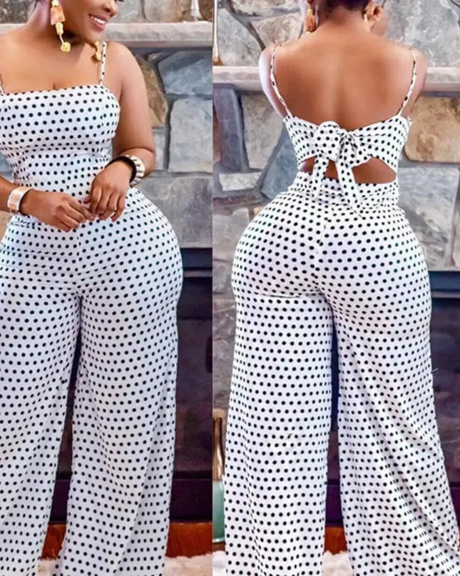 Woman wearing a black and white polka dot jumpsuit with cut-out design, shown from front and back.