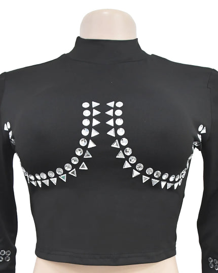 Black long-sleeve top with decorative silver embellishments on a mannequin against a white background