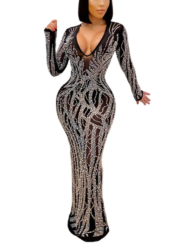 Woman wearing a black and silver patterned dress in a minimal setting