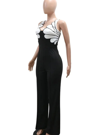 Mannequin wearing a black jumpsuit with white floral patterns on a white background
