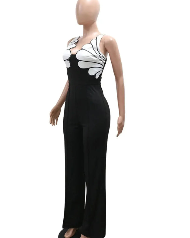 Mannequin wearing a black jumpsuit with white floral patterns on a white background