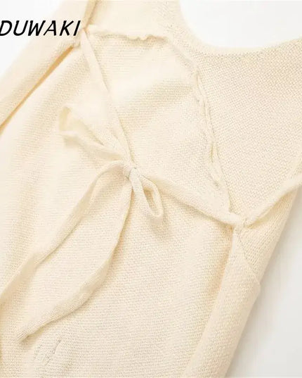 KADUWAKI gothic embroidered dresses for women featuring a close-up of the soft knitted fabric and bow detail.