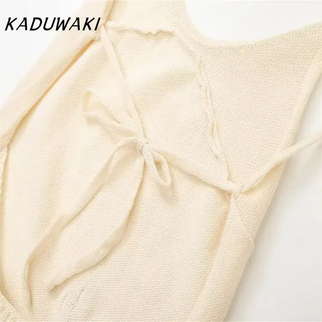KADUWAKI gothic embroidered dresses for women featuring a close-up of the soft knitted fabric and bow detail.