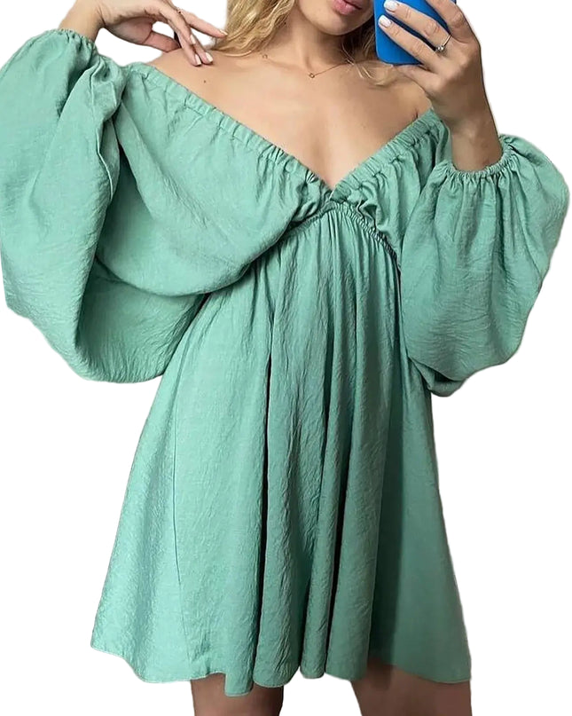 Model wearing a mint green off-shoulder dress with puffed sleeves, showcased in a mirror reflection.
