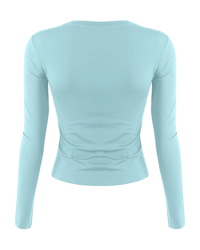 womens long sleeve crop top in light blue color showcasing back view and slim fit design