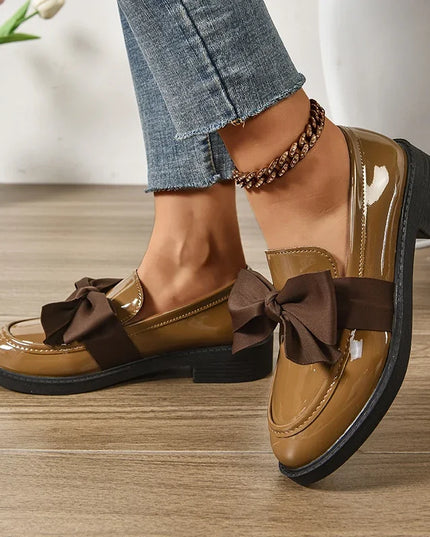 Bow tie loafers for women in brown, featuring medium heel and round toe, perfect for daily outdoor wear.