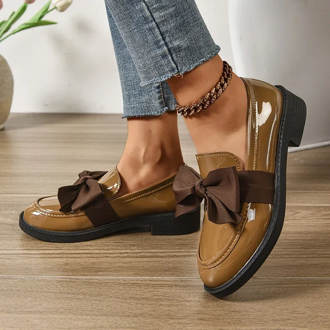 Bow tie loafers for women in brown, featuring medium heel and round toe, perfect for daily outdoor wear.