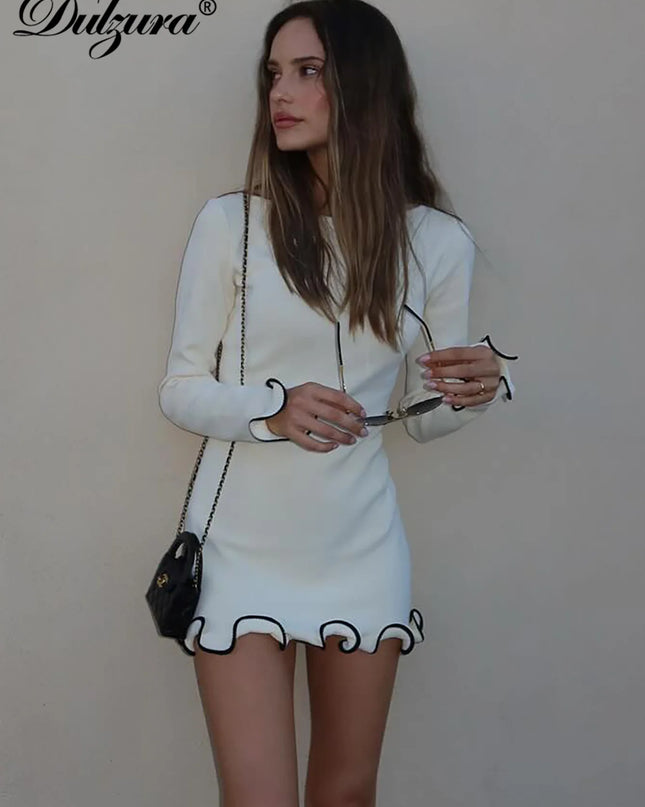 Woman in a white long sleeve ruffled mini dress, showcasing a stylish bodycon fit for modern elegance.