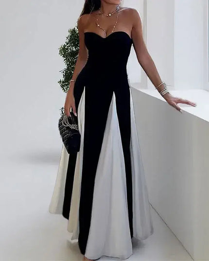 Elegant woman wearing a color contrast evening party dress with a V-neck and off-shoulder design, perfect for holiday occasions.