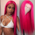 Woman with bright pink wig and wig cap on a plain background
