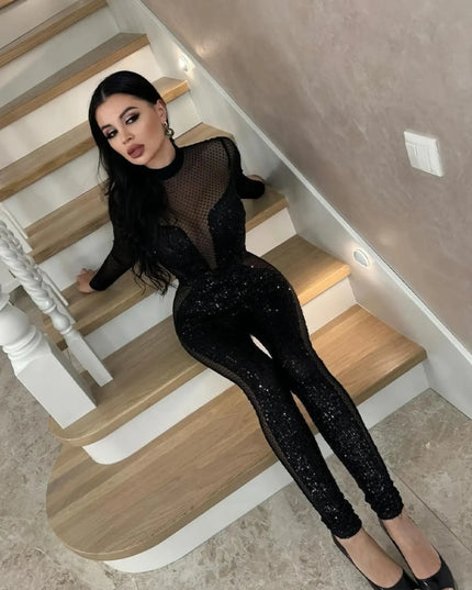 Person wearing a black outfit sitting on a staircase