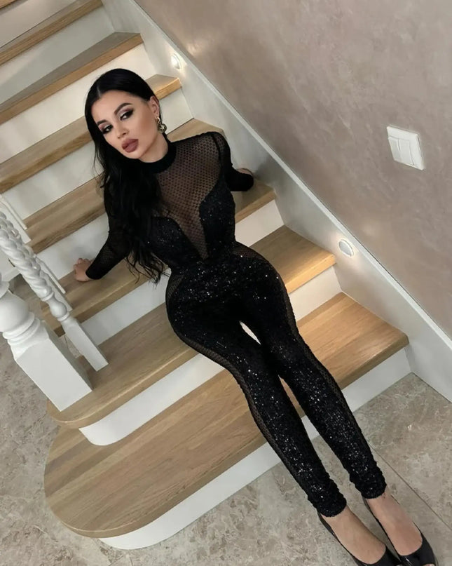 Person wearing a black outfit sitting on a staircase