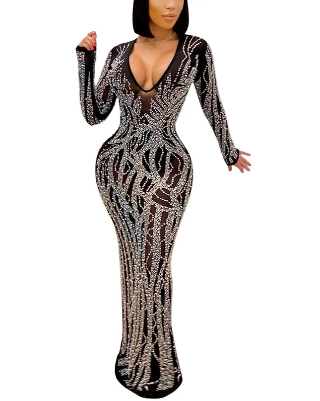 Black and silver patterned dress on a model against a pink background