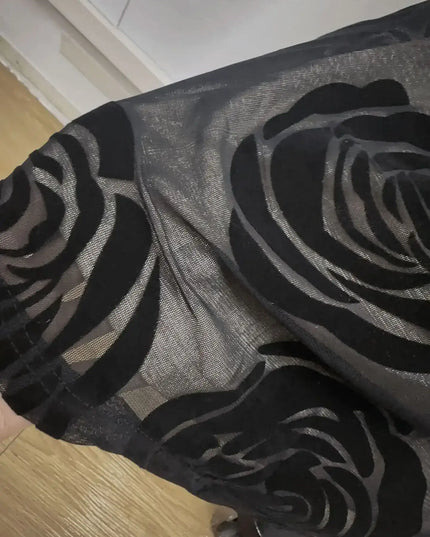 Close-up of black mesh fabric with rose pattern, showcasing elegant design for Oligai one shoulder elegant dress.