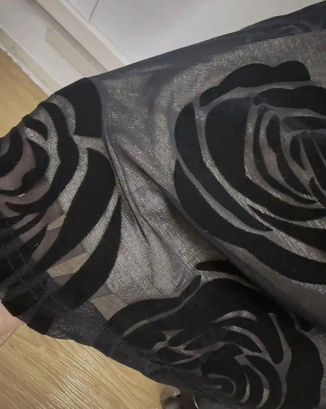 Close-up of black mesh fabric with rose pattern, showcasing elegant design for Oligai one shoulder elegant dress.