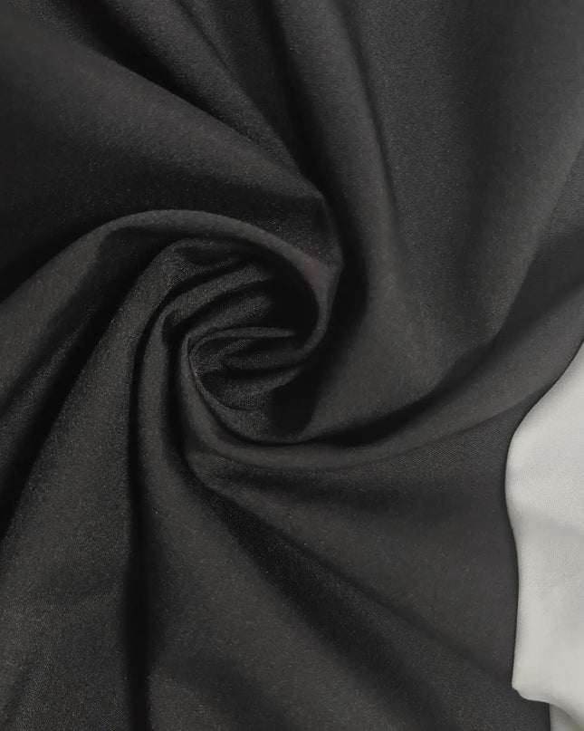 Fabric swirls of black and white, showcasing the luxurious texture perfect for a color contrast evening party dress.