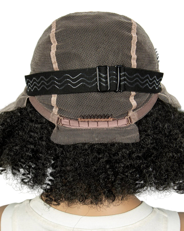 Back view of a wig with a mesh cap and black hair extensions.