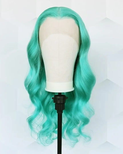 Turquoise wig on a mannequin head against a white background