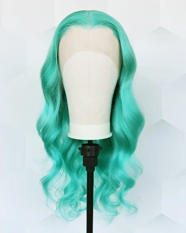 Turquoise wig on a mannequin head against a white background