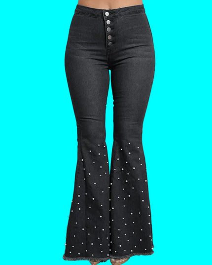 Black bell-bottom pants with decorative buttons on a turquoise background