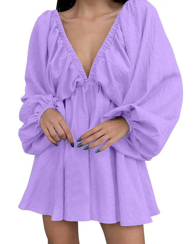 Purple dress with long sleeves on a white background