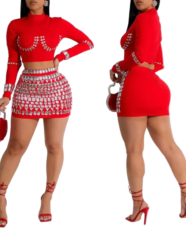 Red outfit with embellishments worn by a model on a white background