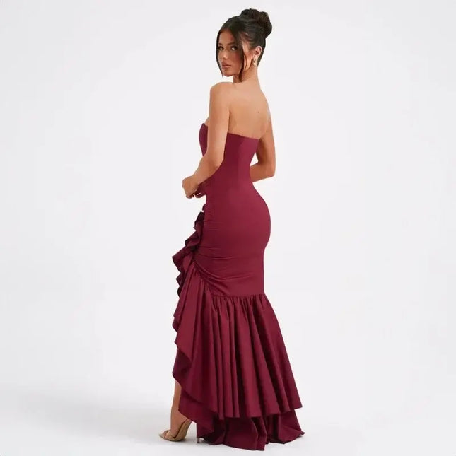 Sexy strapless summer dress in burgundy with a ruffled irregular hem, showcasing a sophisticated design.