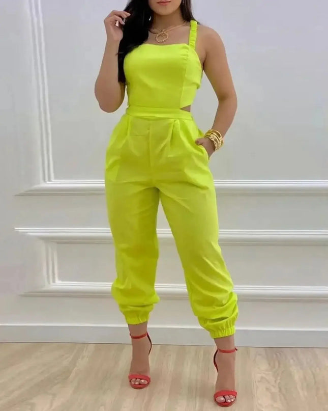Person wearing a bright yellow jumpsuit with a white wall background