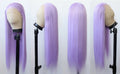 Four mannequin heads with purple wigs on stands against a white background