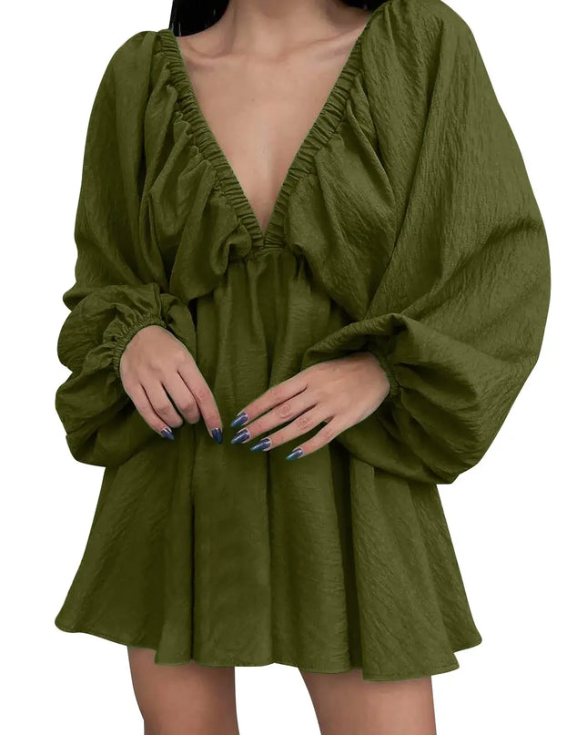 Green dress with long sleeves on a white background