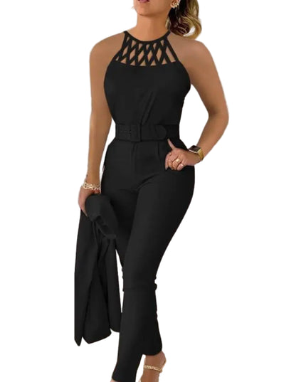 Woman wearing a black jumpsuit with a unique top design in a room.