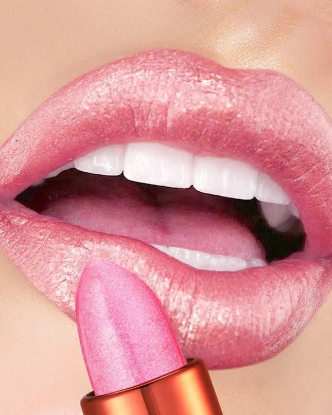 Close-up of pink lipstick being applied to a lip with a beige background