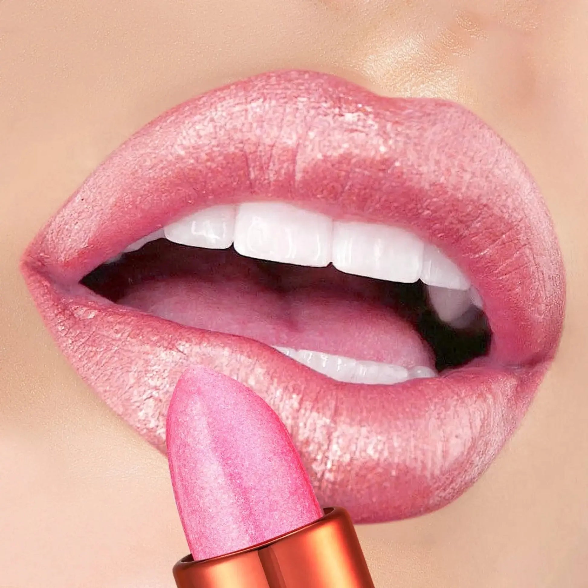 Close-up of pink lipstick being applied to a lip with a beige background