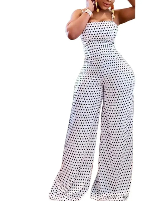 Woman wearing a polka dot jumpsuit on a white background