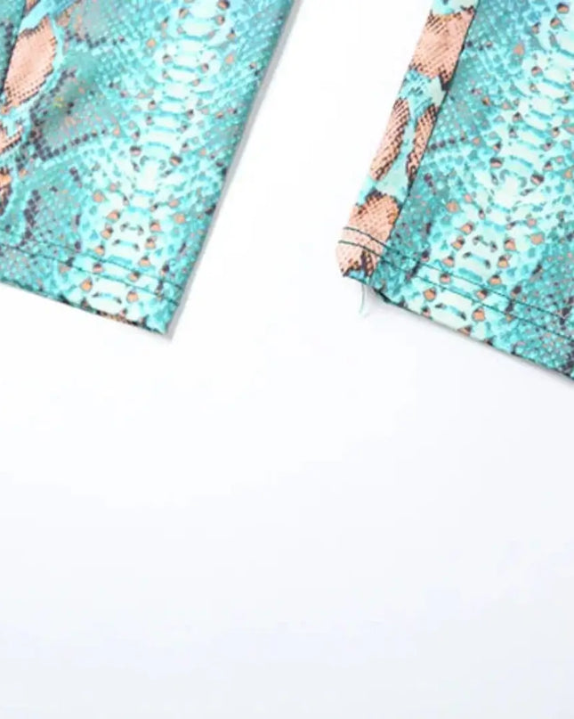 Two turquoise fabric swatches with a rose gold metallic pattern on a white background