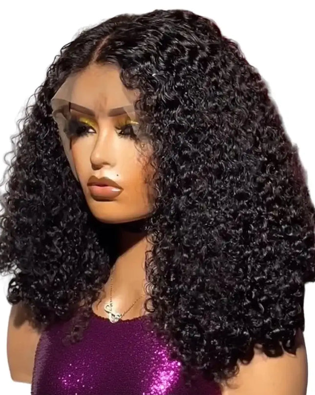 Mannequin head with a black curly wig in front of pink flowers